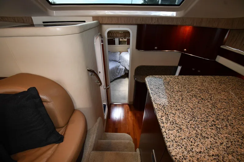 Seriously Yacht Photos Pics Luxurious interior of 2005 Sea Ray 390 Motor Yacht with granite countertops and cozy seating.