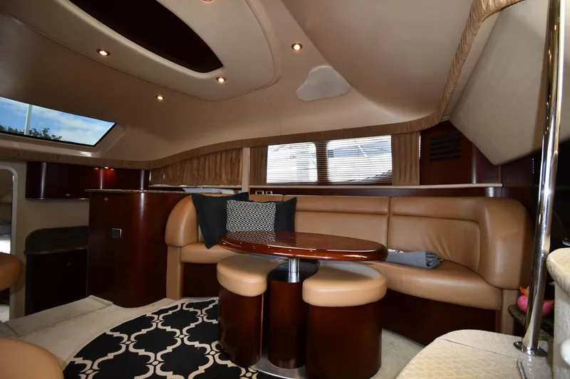 Seriously Yacht Photos Pics Luxurious interior of 2005 Sea Ray 390 Motor Yacht with leather seating and elegant decor.