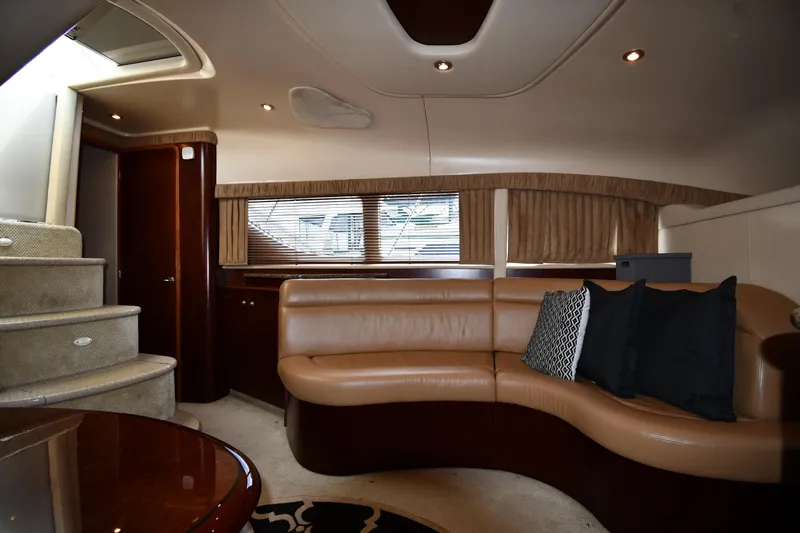 Seriously Yacht Photos Pics Luxurious interior of 2005 Sea Ray 390 Motor Yacht with leather seating and elegant design.