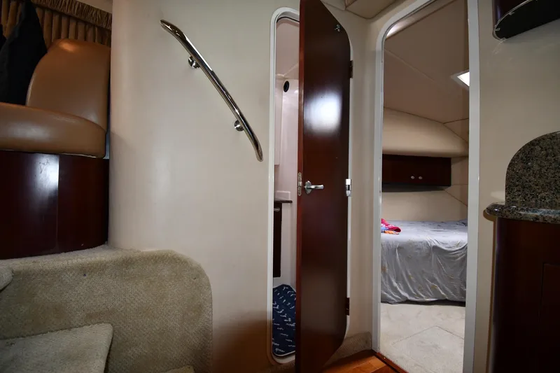 Seriously Yacht Photos Pics Interior view of 2005 Sea Ray 390 Motor Yacht, featuring stairs and bedroom entrance.