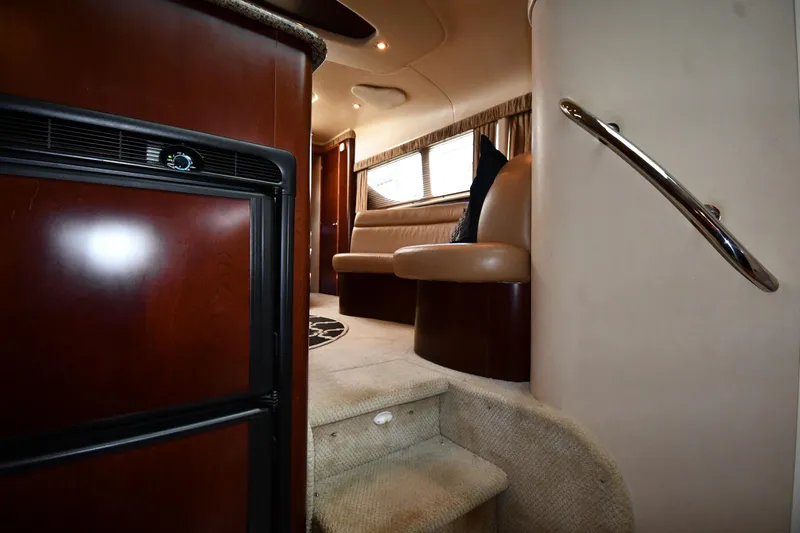 Seriously Yacht Photos Pics Interior of 2005 Sea Ray 390 Motor Yacht with stairs, seating, and wood finishes.