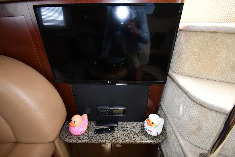 Seriously Yacht Photos Pics 2005 Sea Ray 390 Motor Yacht interior with TV, rubber ducks, and granite surface.