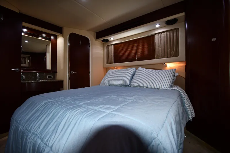 Seriously Yacht Photos Pics Luxurious bedroom interior of 2005 Sea Ray 390 Motor Yacht with cozy bedding.