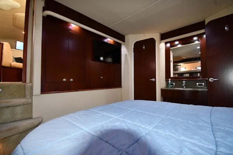 Seriously Yacht Photos Pics Luxurious interior of 2005 Sea Ray 390 Motor Yacht with wood cabinetry and cozy bedding.