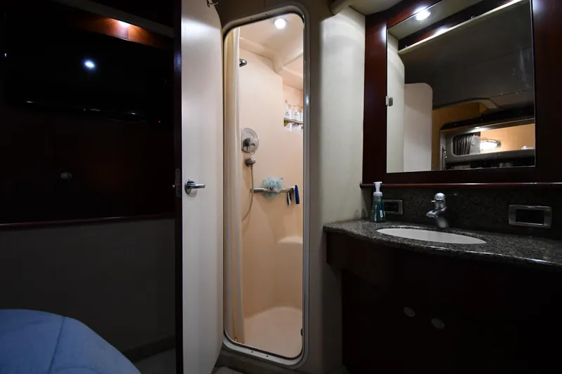 Seriously Yacht Photos Pics 2005 Sea Ray 390 Motor Yacht bathroom with shower, sink, and mirror.