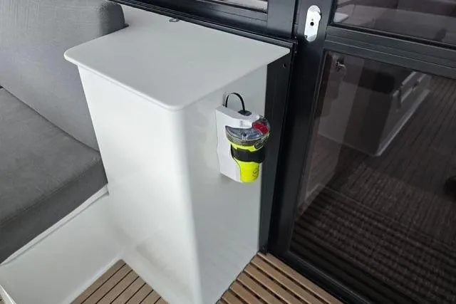 Island Nomad Yacht Photos Pics 2022 Fountaine Pajot Tanna 47 interior with modern seating and safety equipment.