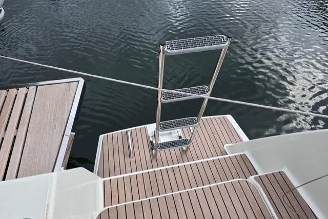 Island Nomad Yacht Photos Pics 2022 Fountaine Pajot Tanna 47 yacht with teak deck and swim ladder.