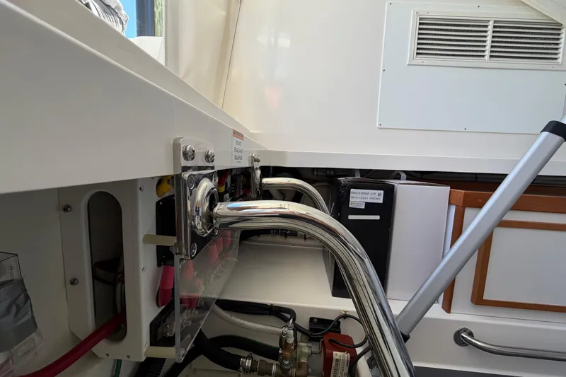 Pivot Yacht Photos Pics 2023 Back Cove 340 boat interior showing engine compartment and metal fittings.