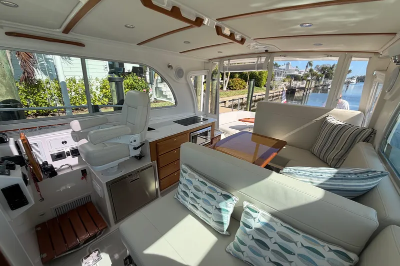 Pivot Yacht Photos Pics Luxurious interior of 2023 Back Cove 340 yacht with plush seating and elegant design.