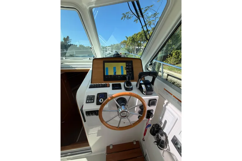 Pivot Yacht Photos Pics 2023 Back Cove 340 helm with modern controls and navigation display.