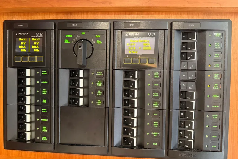 Pivot Yacht Photos Pics Electrical control panel on a 2023 Back Cove 340 boat, featuring Blue Sea Systems displays.