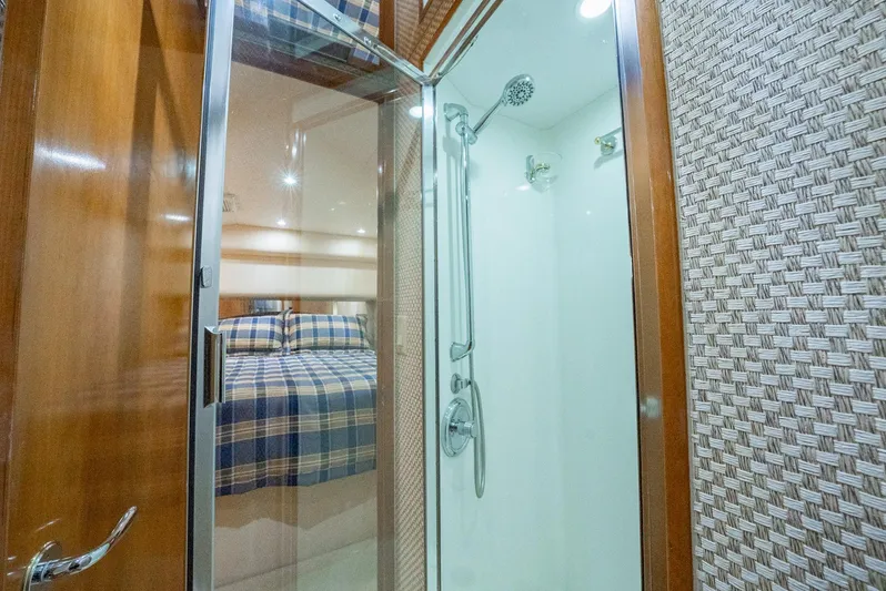 Fortitude Yacht Photos Pics Shower and bedroom interior of 2001 Hatteras 50 Convertible yacht.