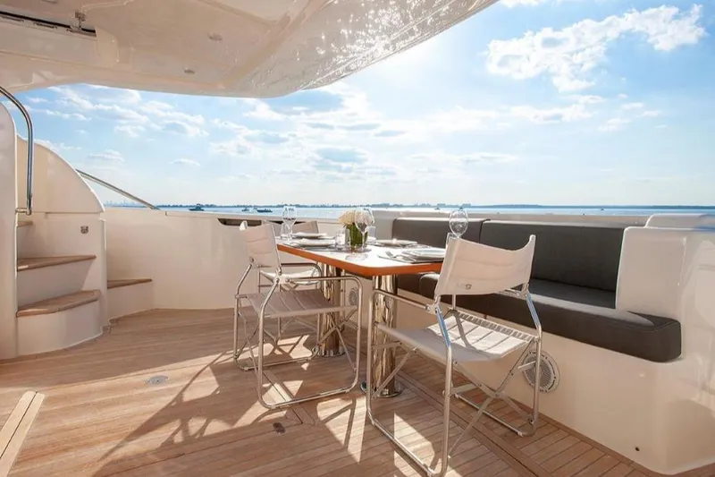 Matsu Yacht Photos Pics Luxurious 2018 Ferretti Yachts 650 deck with elegant dining setup and ocean view.