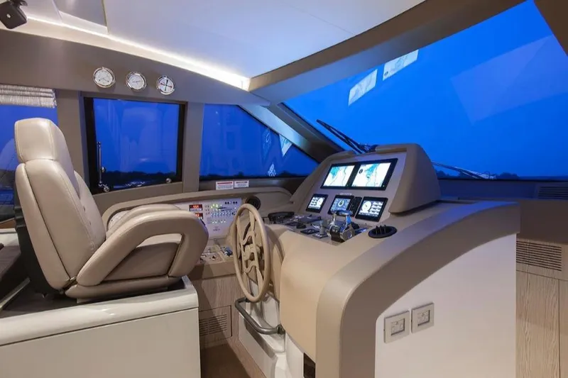 Matsu Yacht Photos Pics Luxurious 2018 Ferretti Yachts 650 helm with modern navigation controls and plush seating.
