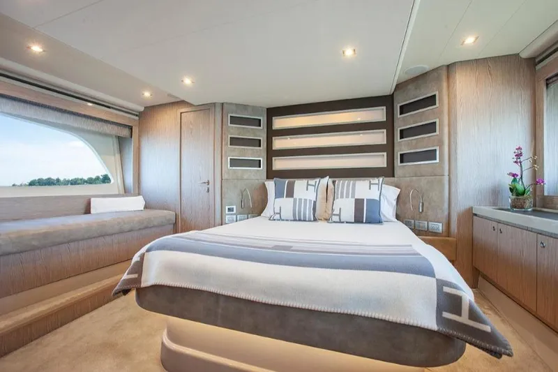 Matsu Yacht Photos Pics Luxurious bedroom interior of 2018 Ferretti Yachts 650 with modern design and large windows.