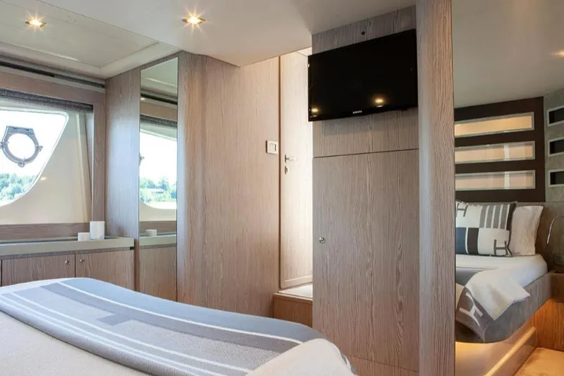 Matsu Yacht Photos Pics Luxurious interior of 2018 Ferretti Yachts 650, featuring elegant wood finishes and modern amenities.