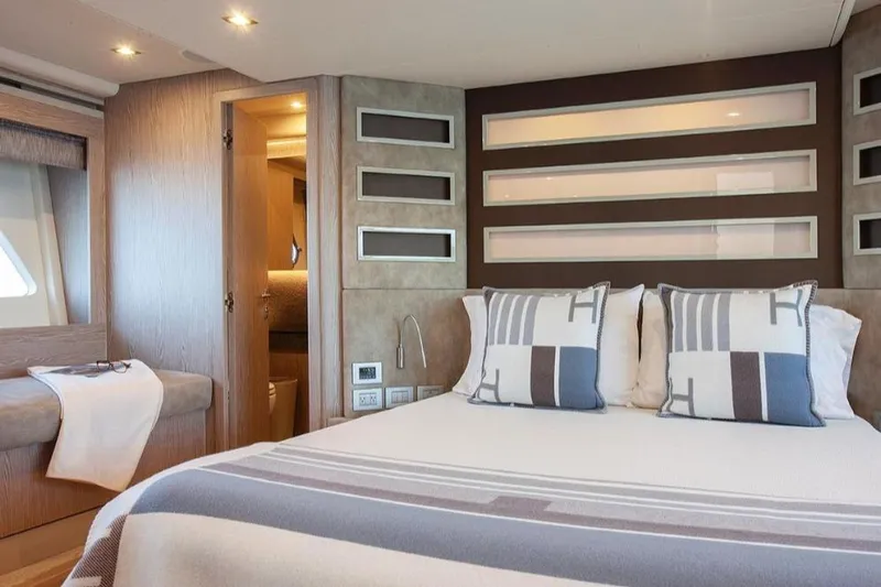 Matsu Yacht Photos Pics Luxurious bedroom interior of 2018 Ferretti Yachts 650 with modern design and cozy bedding.