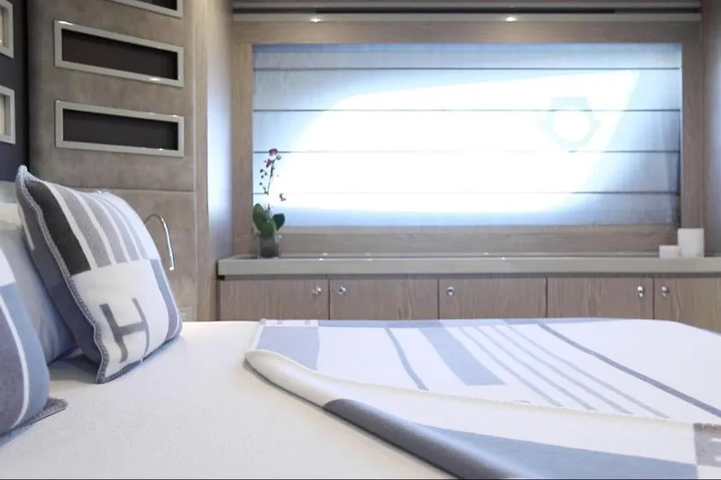 Matsu Yacht Photos Pics Luxurious interior of 2018 Ferretti Yachts 650, featuring elegant bedding and modern decor.