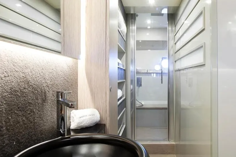 Matsu Yacht Photos Pics Luxurious bathroom interior of 2018 Ferretti Yachts 650 with modern fixtures and elegant design.