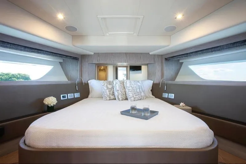 Matsu Yacht Photos Pics Luxurious bedroom interior of 2018 Ferretti Yachts 650 with elegant bedding and modern design.