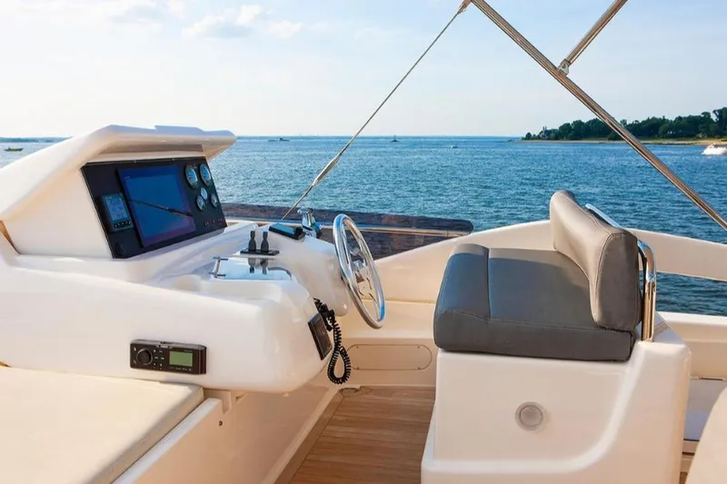 Matsu Yacht Photos Pics Flybridge of 2018 Ferretti Yachts 650 with ocean view and navigation controls.