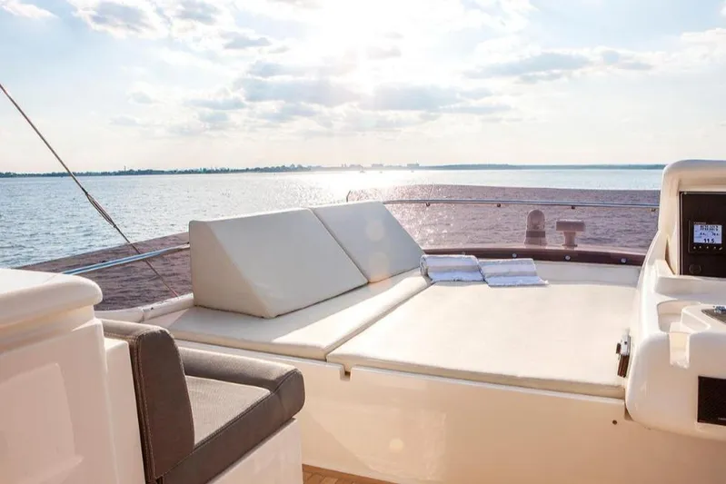 Matsu Yacht Photos Pics Luxurious 2018 Ferretti Yachts 650 deck with sun loungers overlooking serene ocean view.