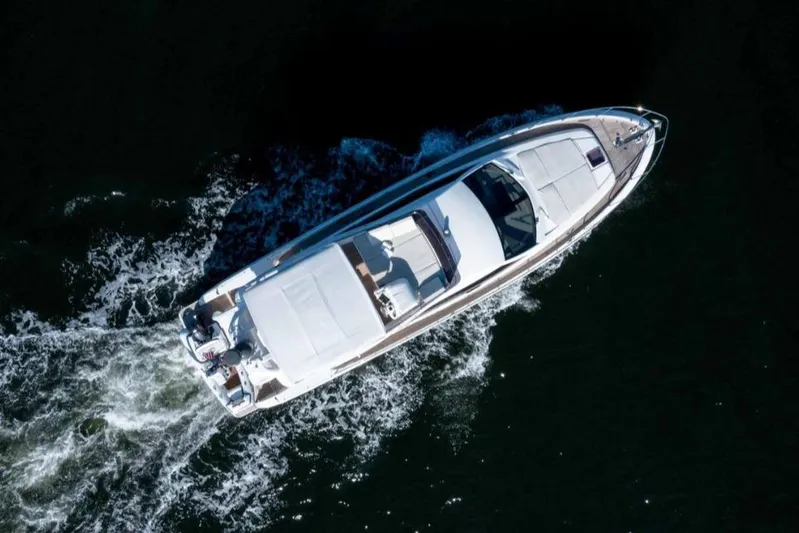 Matsu Yacht Photos Pics Aerial view of 2018 Ferretti Yachts 650 cruising on open water.