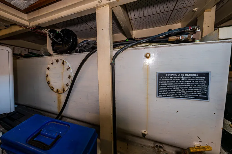 Skagit Song Yacht Photos Pics Engine room of 1984 Grand Banks 36 Sedan with fuel tank and safety notice.