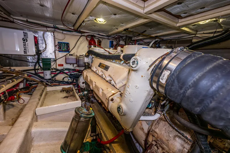 Skagit Song Yacht Photos Pics Engine room of a 1984 Grand Banks 36 Sedan boat, showcasing mechanical components.