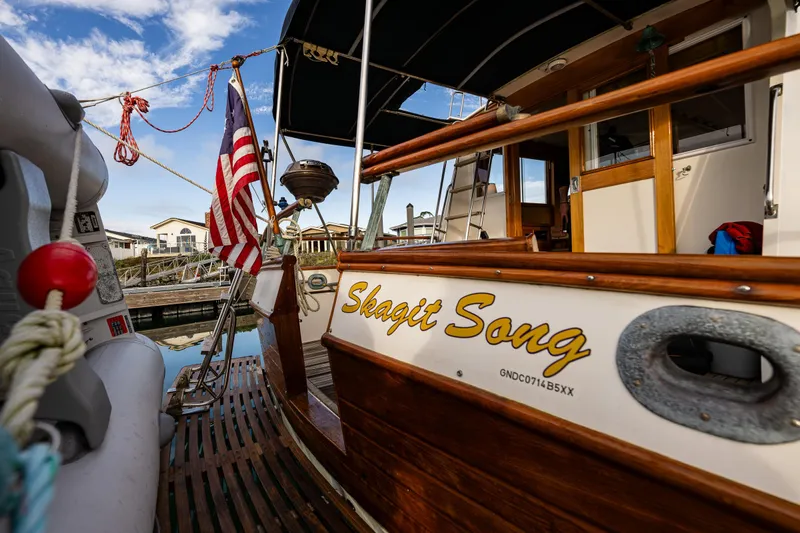 Skagit Song Yacht Photos Pics 1984 Grand Banks 36 Sedan boat named "Skagit Song" docked with American flag.