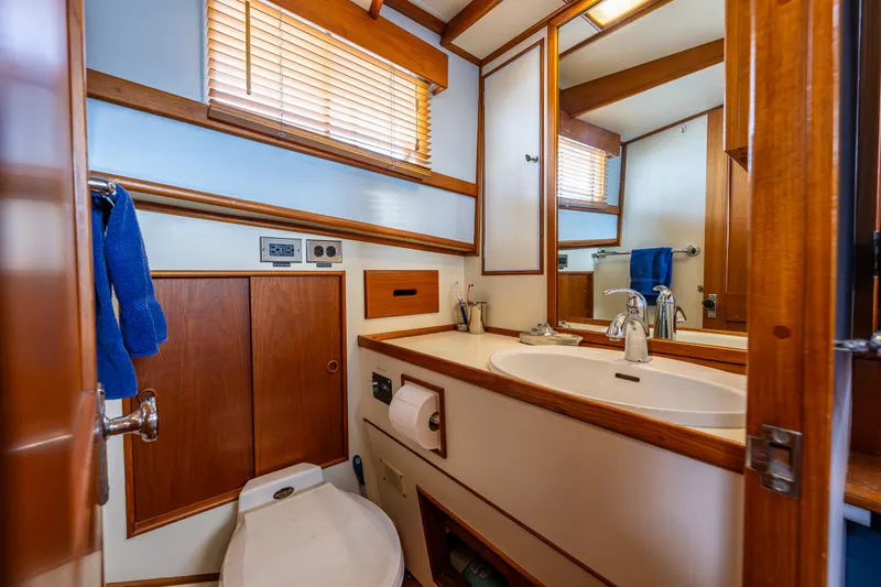 Skagit Song Yacht Photos Pics 1984 Grand Banks 36 Sedan bathroom with wooden accents and modern fixtures.
