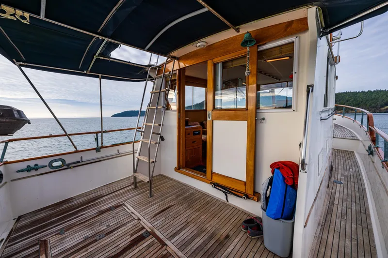 Skagit Song Yacht Photos Pics 1984 Grand Banks 36 Sedan yacht deck with wooden flooring and ocean view.