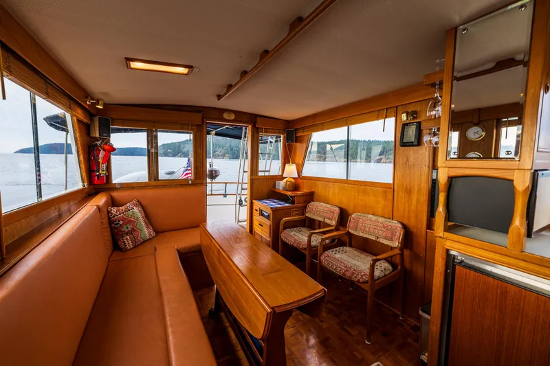 Skagit Song Yacht Photos Pics Interior of 1984 Grand Banks 36 Sedan, featuring wood paneling and comfortable seating.