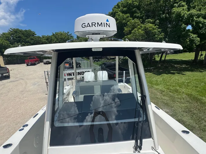  Yacht Photos Pics 2022 Pursuit S 288 Sport boat with Garmin radar, parked outdoors.