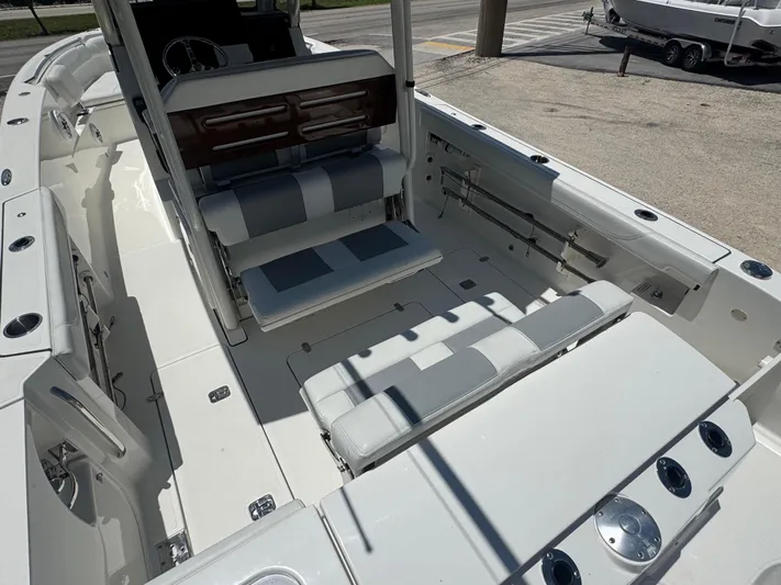  Yacht Photos Pics 2022 Pursuit S 288 Sport boat interior with seating and rod holders.