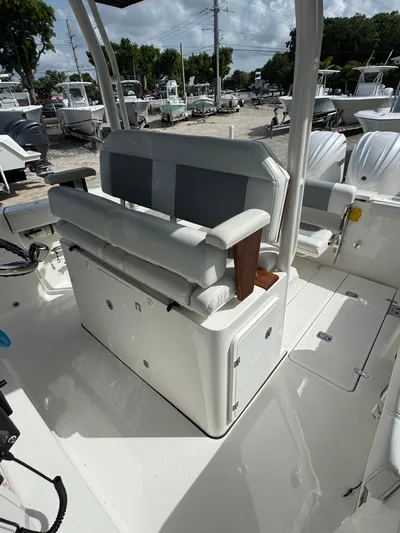  Yacht Photos Pics 2022 Pursuit S 288 Sport boat interior with seating and storage compartments.