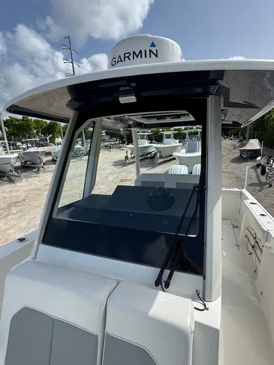  Yacht Photos Pics 2022 Pursuit S 288 Sport boat with Garmin equipment, docked in a marina.
