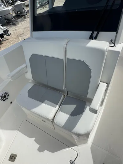  Yacht Photos Pics 2022 Pursuit S 288 Sport boat seating with gray and white upholstery.