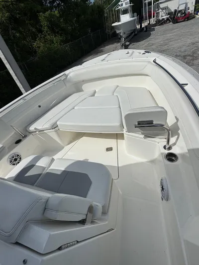  Yacht Photos Pics 2022 Pursuit S 288 Sport boat interior with white seating and modern design.