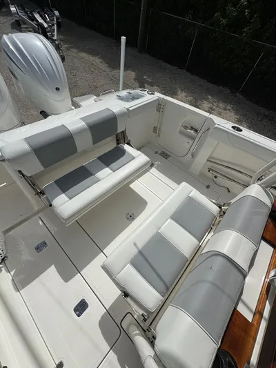 Yacht Photos Pics 2022 Pursuit S 288 Sport boat interior with white and gray seating.