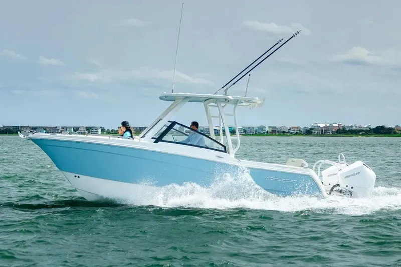  Yacht Photos Pics Manufacturer Provided Image: 2026 World Cat 265 DC-X boat cruising on water, featuring sleek design and dual Mercury engines.