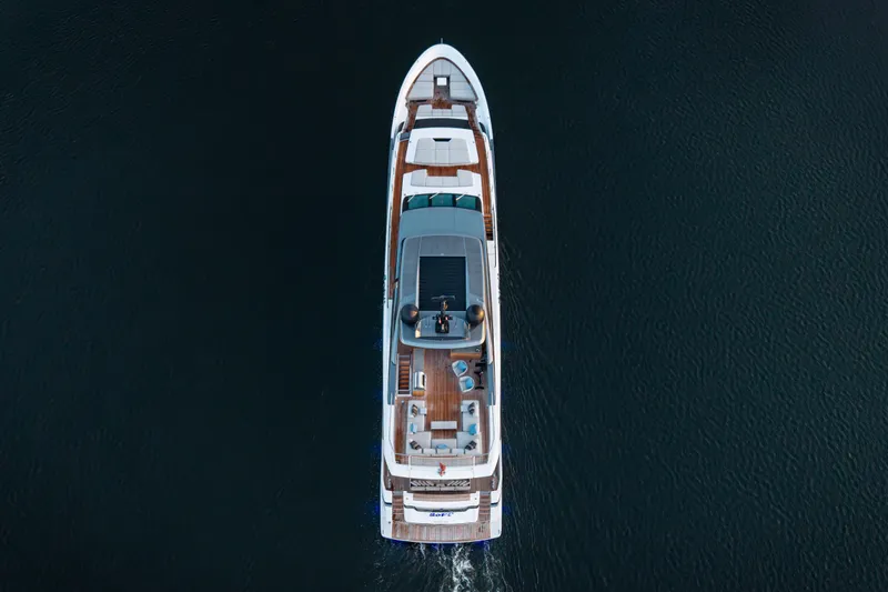 Sofi VI Yacht Photos Pics Aerial view of 2023 Sanlorenzo SL120A yacht cruising on dark water.