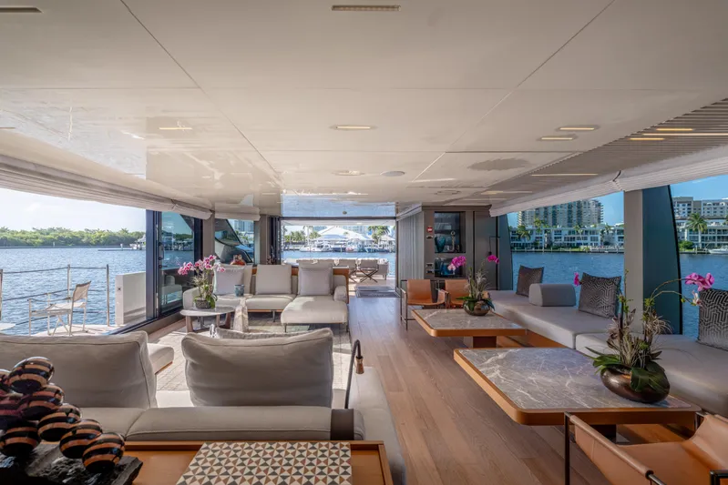 Sofi VI Yacht Photos Pics Luxurious interior of 2023 Sanlorenzo SL120A yacht with elegant seating and waterfront view.