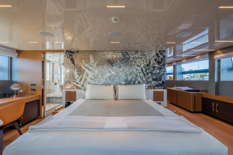 Sofi VI Yacht Photos Pics Luxurious bedroom interior of 2023 Sanlorenzo SL120A yacht with modern decor and large windows.