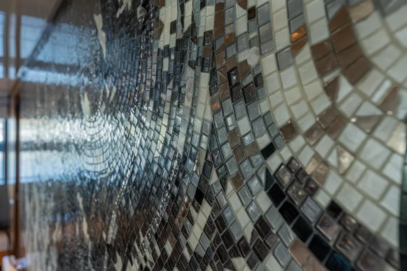 Sofi VI Yacht Photos Pics Close-up of intricate mosaic tiles on 2023 Sanlorenzo SL120A yacht interior.