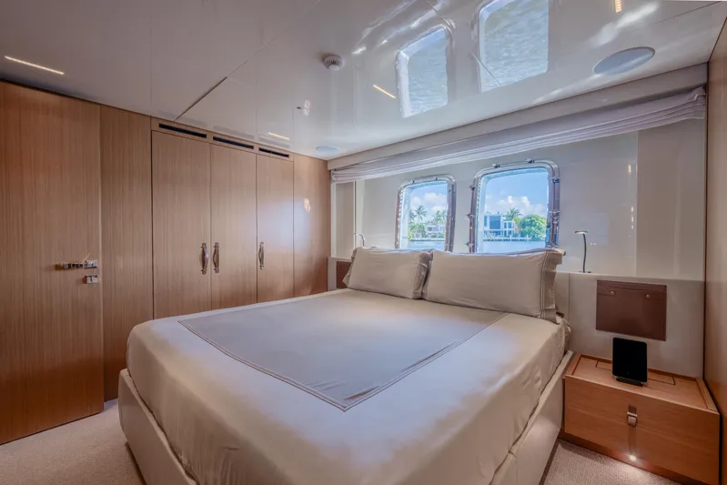 Sofi VI Yacht Photos Pics Luxurious bedroom interior of 2023 Sanlorenzo SL120A yacht with elegant wood finishes.