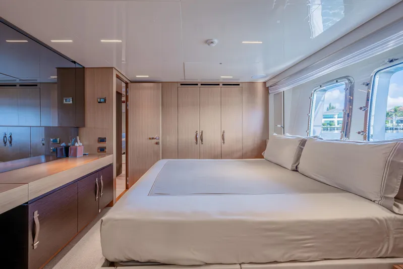 Sofi VI Yacht Photos Pics Luxurious bedroom interior of 2023 Sanlorenzo SL120A yacht with modern design and large windows.