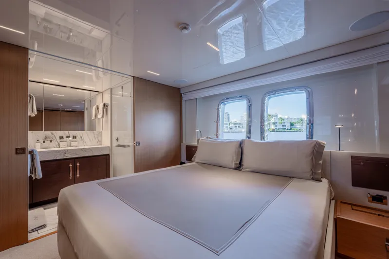 Sofi VI Yacht Photos Pics Luxurious bedroom interior of 2023 Sanlorenzo SL120A yacht with elegant design and large windows.