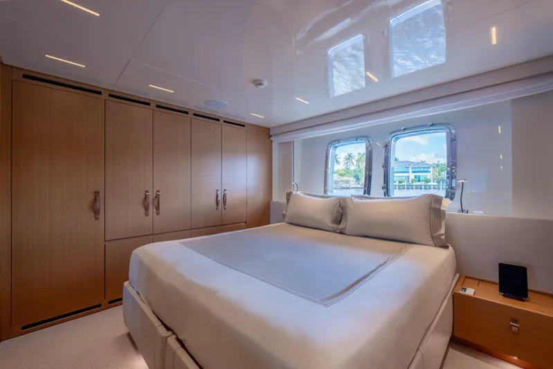 Sofi VI Yacht Photos Pics Luxurious bedroom interior of 2023 Sanlorenzo SL120A yacht with elegant wood finishes.