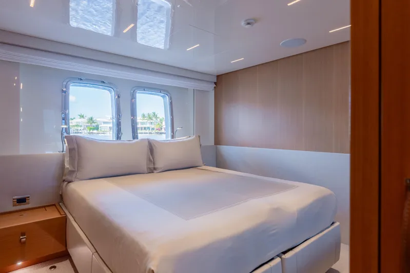 Sofi VI Yacht Photos Pics Luxurious bedroom interior of 2023 Sanlorenzo SL120A yacht with large windows and elegant design.